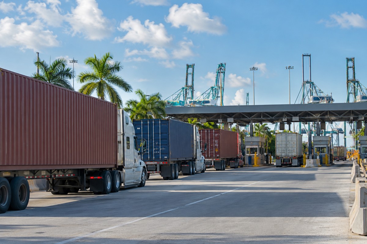 Container trucks waiting at a terminal entrance